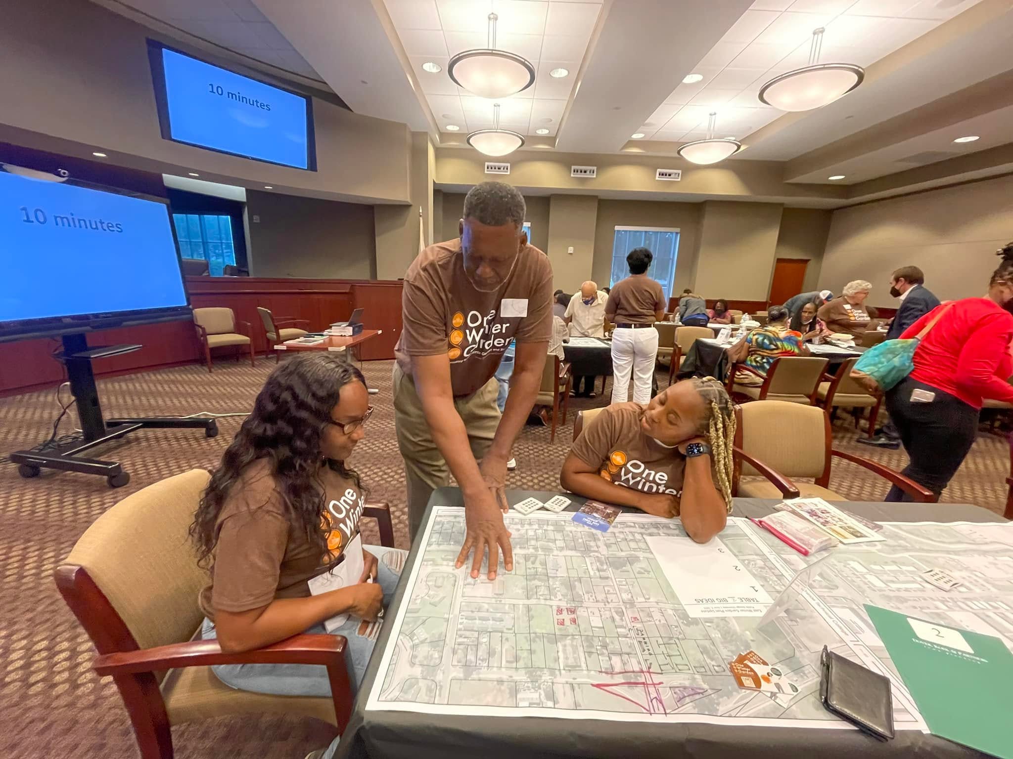 One Winter Garden community members planning the future of East Winter Garden around a neighborhood map